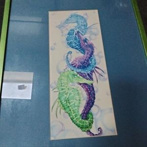 Sea horse art in frame